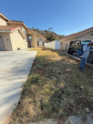Front-Yard Design - For this side yard, we created a clean and low-maintenance design with artificial turf and decorative river rock. The turf was cut with smooth, natural curves and bordered with stone for a polished finish. The rock edge not only adds contrast but also helps with drainage, keeping the area functional and looking sharp year-round. Front-Yard Design - For this side yard, we created a clean and low-maintenance design with artificial turf and decorative river rock. The turf was cut with smooth, natural curves and bordered with stone for a polished finish. The rock edge not only adds contrast but also helps with drainage, keeping the area functional and looking sharp year-round.