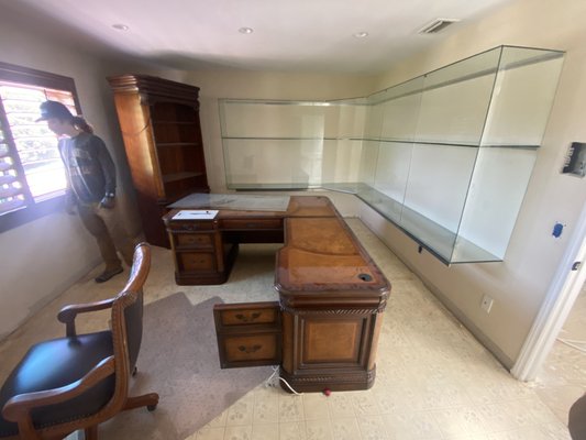 Upstairs office cleanup + demo - This is one room of a large job where a majority of the items were on the 2nd floor. The room included a large desk, large bookcase, chair, and a lot of built in glass shelving. When we arrived we assured the client we would be able to get the items out despite another junk removal business informing them they couldn't. We informed the client of how much it would cost based on our simple volume based pricing. Within an hour we had removed all the items from this room including the built in glass. Give us a call and let us know what STUFF you would like to make disappear. Upstairs office cleanup + demo - This is one room of a large job where a majority of the items were on the 2nd floor. The room included a large desk, large bookcase, chair, and a lot of built in glass shelving. When we arrived we assured the client we would be able to get the items out despite another junk removal business informing them they couldn't. We informed the client of how much it would cost based on our simple volume based pricing. Within an hour we had removed all the items from this room including the built in glass. Give us a call and let us know what STUFF you would like to make disappear.
