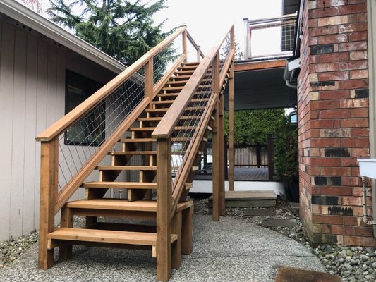 Deck reconstruction - The homeowner wanted a staircase leading down into her backyard. Since her deck didn’t have any stairs, she reached out to us for help and we were happy to take on the job.
When the day came, we worked efficiently and with care, building the staircase just the way she asked. The result was a beautiful, well-crafted staircase that now provides easy access to her backyard. Deck reconstruction - The homeowner wanted a staircase leading down into her backyard. Since her deck didn’t have any stairs, she reached out to us for help and we were happy to take on the job.
When the day came, we worked efficiently and with care, building the staircase just the way she asked. The result was a beautiful, well-crafted staircase that now provides easy access to her backyard.