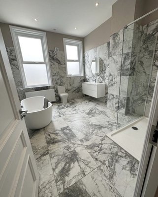 Luxury Marble Bathroom - This bathroom was very dated, and we gave it a modern luxury look. Full marble tile renovation with beautiful new fixtures. Luxury Marble Bathroom - This bathroom was very dated, and we gave it a modern luxury look. Full marble tile renovation with beautiful new fixtures.