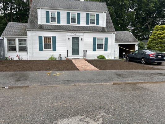 Front Yard Rehab - DC EXCO installed drywells in the front yard, raised the grade 6” and created proper pitch away from the home. We also reset the front walkway and installed bluestone around the plant beds.