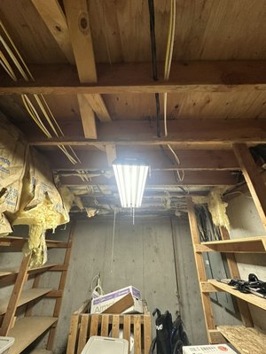 Storage Room remodel - We upgraded this old storage room to a finished room. We tore out the old shelves and primed and painted the cement walls, and drywalled the walls and ceilings to clover up the insulation. Finished it up with some freshly painted and newly built shelving to complete this upgrade.