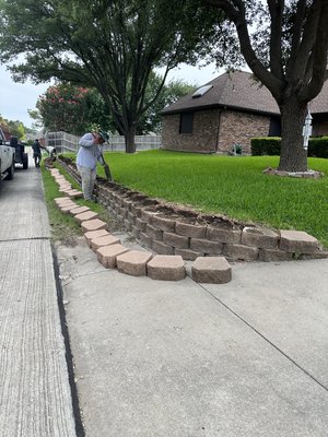 Retaining wall reconstruction - This clients retaining wall was leaning, close to falling so we completely took it down & rebuilt it using the same pavers. Retaining wall reconstruction - This clients retaining wall was leaning, close to falling so we completely took it down & rebuilt it using the same pavers.