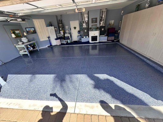 Prime Blue Garage Floor Coating - This garage was upgraded with a Prime Blue full broadcast floor coating featuring a blue, black, gray, and white flake blend. The finished coating gives the garage floor a clean, polished look with a durable surface designed for everyday use. Prime Blue Garage Floor Coating - This garage was upgraded with a Prime Blue full broadcast floor coating featuring a blue, black, gray, and white flake blend. The finished coating gives the garage floor a clean, polished look with a durable surface designed for everyday use.