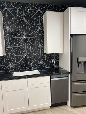 Black Hexagon Tiles in Backsplash - This Backsplash was done at an office kitchen at Rancho Santa Margarita. Client requested the tiles to be centered to the sink, so we made it work. This was a 2 day project. Finished product looked amazing, really loved working on this one. Black Hexagon Tiles in Backsplash - This Backsplash was done at an office kitchen at Rancho Santa Margarita. Client requested the tiles to be centered to the sink, so we made it work. This was a 2 day project. Finished product looked amazing, really loved working on this one.