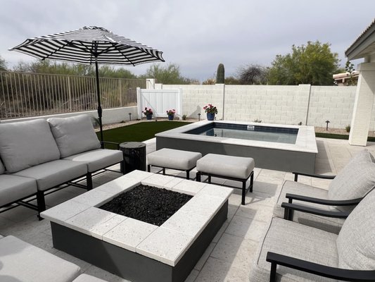 Cave Creek Backyard Remodel and Spa Addition - Check out this beautiful full backyard remodel with a propane heated SPA addition, which we completed in Cave Creek. We maximized the yard space using Shellock Ivory Artistic Pavers and a large section of Daytona #80oz artificial turf. These clients will be enjoying their winter evenings in their new propane-heated spa. We also added a new barbecue and fire pit area, which also uses propane. We utilized the artistic pavers for the spa coping and the fire pit cap. The plants we installed are all fairly drought-tolerant and will add a large pop of color to the landscape. Our client has a view fence, so we needed to get approval from the HOA for this one as well. Our HOA packages get you approved very quickly, and we help throughout the entire process with them. If you are looking for a complete yard transformation, we would love the opportunity to build your dream yard. Cave Creek Backyard Remodel and Spa Addition - Check out this beautiful full backyard remodel with a propane heated SPA addition, which we completed in Cave Creek. We maximized the yard space using Shellock Ivory Artistic Pavers and a large section of Daytona #80oz artificial turf. These clients will be enjoying their winter evenings in their new propane-heated spa. We also added a new barbecue and fire pit area, which also uses propane. We utilized the artistic pavers for the spa coping and the fire pit cap. The plants we installed are all fairly drought-tolerant and will add a large pop of color to the landscape. Our client has a view fence, so we needed to get approval from the HOA for this one as well. Our HOA packages get you approved very quickly, and we help throughout the entire process with them. If you are looking for a complete yard transformation, we would love the opportunity to build your dream yard.
