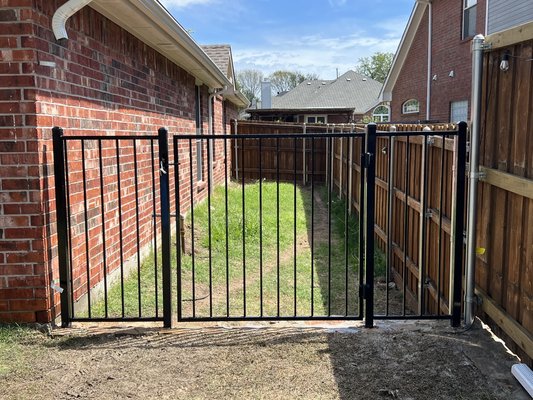 Iron Fence Installation - The customer had wanted us to build an iron fence to protect his kids from possibly falling off the retaining wall. We installed and welded a new high quality fence that is galvanized inside and out with a powder coated finish. Paired with some adjustable auto closing hinges. Iron Fence Installation - The customer had wanted us to build an iron fence to protect his kids from possibly falling off the retaining wall. We installed and welded a new high quality fence that is galvanized inside and out with a powder coated finish. Paired with some adjustable auto closing hinges.