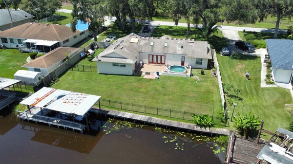 New Roof Central Florida - We removed the old roof and installed a new roof on the home and boat house.. We also installed all new gutters. New Roof Central Florida - We removed the old roof and installed a new roof on the home and boat house.. We also installed all new gutters.