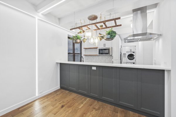 Upper West Side Apartment Remodel - We helped the Sacara family renovate their 1,200-square-foot home in the prime Upper West Side location. The original layout included two bedrooms with a shared bathroom, a combined living/dining room area, and a separate kitchen. The family wanted to complete a full apartment renovation and make the layout more functional by adding a second bathroom, laundry room, and additional closets as well as creating an open kitchen concept.