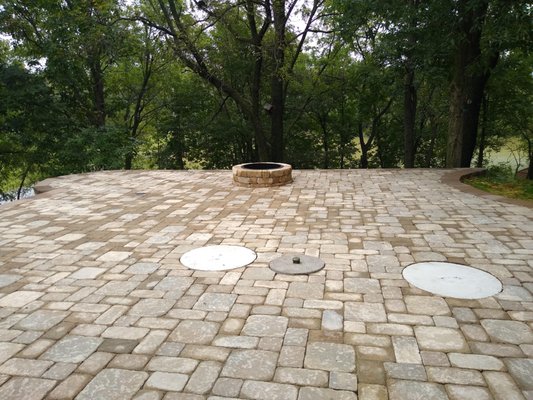 Patio with Landscaping and Erosion Control - his project took less than a week to complete. We added a patio, additional landscaping and used river rocks to help with erosion control.