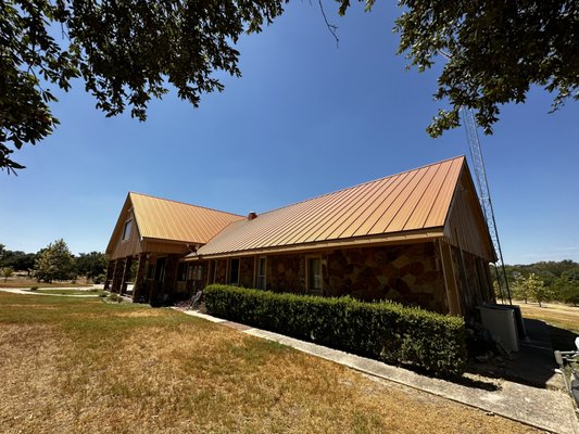 24 Gauge Copper Penny Snap-Lock - Check out the beautiful transformation of this homes roof. The customer initially had a Galvalume R-Panel roof system but chose to upgrade to a 24 Gauge Copper Penny Snap-Lock Roof. Not only does the standing seam Copper Penny roof bring great curb appeal but also brings added benefits by being completely internally fastened.
At FSR Roofing, we prioritize the longevity and quality of your roof, which is why we recommend tearing off an existing metal roof down to the decking for any new installation. This approach ensures that we can fully assess and prepare the underlying structure, addressing any hidden issues and setting a solid foundation for the new roofing.
 By starting fresh, we not only enhance the performance and durability of your roof but also ensure that our work is fully warrantable. This meticulous process allows us to stand confidently behind our guarantee, providing you with the peace of mind that your investment is well-protected and expertly installed