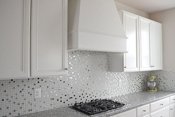 Kitchen backsplash installation with fine glass mosaic detailing - Transform your kitchen with the elegance of a Fine Glass Mosaic Backsplash! The shimmering glass tiles add depth, light, and a touch of luxury to your space, creating a stunning focal point behind your countertops. Durable, easy to clean, and beautifully detailed, this backsplash not only enhances your kitchen’s style but also adds lasting value to your home.