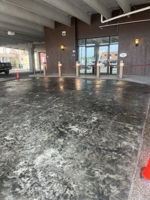 New stamped valet pad for the Hampton inn by Hilton in Massillon, OH - What a difference! Old broken & chipped asphalt pull thru becomes a new elegant glossy stamped valet drop off point for Hampton Inn guests.