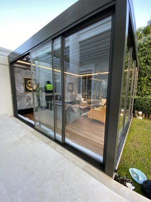 Residential Adjustable Louvered Pergola with Glass Sliding Doors Project - This project is a Residential Adjustable Louvered Pergola integrated seamlessly with our sleek modern Glass Sliding Doors. This client wanted a space to get away from reality and have an escape room to meditate and relax surrounded by the outdoors. The beauty and functionality has shocked our clients imagination and he can now enjoy his meditating sessions in this robust enclosure in peace. Residential Adjustable Louvered Pergola with Glass Sliding Doors Project - This project is a Residential Adjustable Louvered Pergola integrated seamlessly with our sleek modern Glass Sliding Doors. This client wanted a space to get away from reality and have an escape room to meditate and relax surrounded by the outdoors. The beauty and functionality has shocked our clients imagination and he can now enjoy his meditating sessions in this robust enclosure in peace.