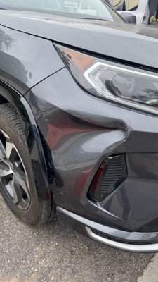 Front Bumper Dent & Scratch Repair - This bumper was very badly dented and scratched. In order to repair we took off the corner of the bumper and pushed out the dent using evenly applied heat to soften the plastic. This results in a flatter finish, and a repair that will last. This is in contrast to other repairs that may use large amounts of body filler that will crack over time. Afterwards we sand, reapply primer, paint and blend into the panel. This achieves our signature great repairs! Front Bumper Dent & Scratch Repair - This bumper was very badly dented and scratched. In order to repair we took off the corner of the bumper and pushed out the dent using evenly applied heat to soften the plastic. This results in a flatter finish, and a repair that will last. This is in contrast to other repairs that may use large amounts of body filler that will crack over time. Afterwards we sand, reapply primer, paint and blend into the panel. This achieves our signature great repairs!