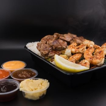 The Unruly Grill Food Truck - For those who love fresh, sizzling meals made right before their eyes, our Teppanyaki truck is the perfect option. We use only the highest quality ingredients, allowing you to build your own plate with a variety of proteins, veggies, and seasonings. Watch as our skilled chefs cook up your meal right on the spot, bringing the heat and flavor straight to your taste buds! The Unruly Grill Food Truck - For those who love fresh, sizzling meals made right before their eyes, our Teppanyaki truck is the perfect option. We use only the highest quality ingredients, allowing you to build your own plate with a variety of proteins, veggies, and seasonings. Watch as our skilled chefs cook up your meal right on the spot, bringing the heat and flavor straight to your taste buds!