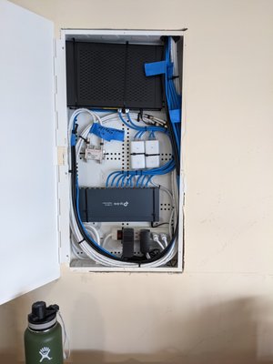 Network Panel and APs 2021 - Installation and termination of network equipment and wires. This panel in particular held the entire homes network equipment from the spectrum modem, network switch, POE injectors for the wireless access points, and cable splitters for the Television cable. Network Panel and APs 2021 - Installation and termination of network equipment and wires. This panel in particular held the entire homes network equipment from the spectrum modem, network switch, POE injectors for the wireless access points, and cable splitters for the Television cable.