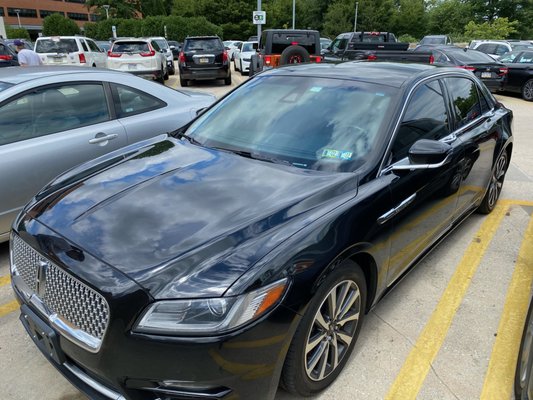 CADILLAC XTS - This is our Cadillac XTS model. It has leather interior, sits three passengers and hold three pieces of luggage.