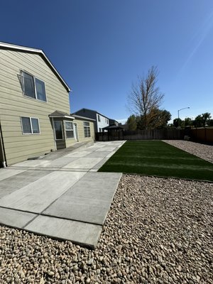 We renovated the backyard located in Thornton - We removed an old deck with stumps and roots that were out of control, starting from scratch and installing a new patio, turf, and rock.
