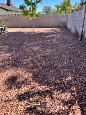 Rock Installation - This landscape was done on a backyard that needed style and needed a touch of color.