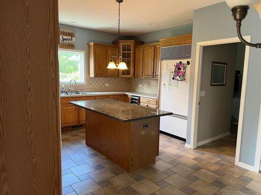 Kitchen project - This remodel included cabinet refacing with modifications of the layout included adding a peninsula, including all new drawers with new custom quartz countertops, new workstation farmers sink and custom wall tile. Cabinetry is painted maple wood in brushed painted grey finis and quartz tops in polished finish.