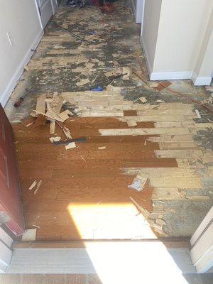 Floor restoration - We removed old floors in the entrance, dining area and replaced them with a nice tile work