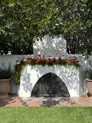 San Clemente Casino Wedding - Our team put together a fireplace mantle install that was broken down and used as the head table centerpieces. We created bud vases, bouquets, and boutonnieres as well. San Clemente Casino Wedding - Our team put together a fireplace mantle install that was broken down and used as the head table centerpieces. We created bud vases, bouquets, and boutonnieres as well.