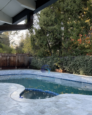 Full backyard remodel - Complete backyard pool transformation! The old coping was a tripping hazard, so we replaced it and leveled the deck to eliminate risk. Out-of-code drains were split to bring them up to safety standards. Beyond the safety upgrades, we resurfaced the pool with smooth mini pebble, installed a new paver deck, elegant marble coping, glass waterline tile, refreshed the wall feature, and added a stunning water feature — turning this backyard into a safe, functional, and beautiful oasis Full backyard remodel - Complete backyard pool transformation! The old coping was a tripping hazard, so we replaced it and leveled the deck to eliminate risk. Out-of-code drains were split to bring them up to safety standards. Beyond the safety upgrades, we resurfaced the pool with smooth mini pebble, installed a new paver deck, elegant marble coping, glass waterline tile, refreshed the wall feature, and added a stunning water feature — turning this backyard into a safe, functional, and beautiful oasis