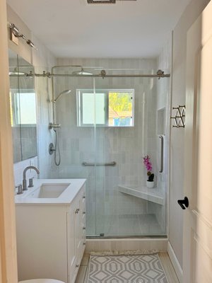 Bathroom remodel - We recently completed a stunning partial bathroom remodel where we replaced an outdated bathtub with a modern walk-in shower. The new design features a sleek floating bench for comfort and convenience, along with a custom-built shampoo niche for added functionality. This transformation not only improved the bathroom’s practicality but also gave it a fresh, contemporary look that perfectly suits the client’s home. Bathroom remodel - We recently completed a stunning partial bathroom remodel where we replaced an outdated bathtub with a modern walk-in shower. The new design features a sleek floating bench for comfort and convenience, along with a custom-built shampoo niche for added functionality. This transformation not only improved the bathroom’s practicality but also gave it a fresh, contemporary look that perfectly suits the client’s home.