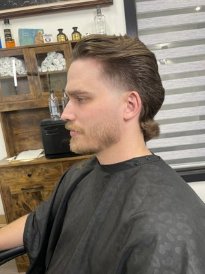 Haircut & Beard Trim - We offer the best haircuts and beard trims in the area! Every haircut comes with a hot towel and razor shave. Book an appointment with us now!