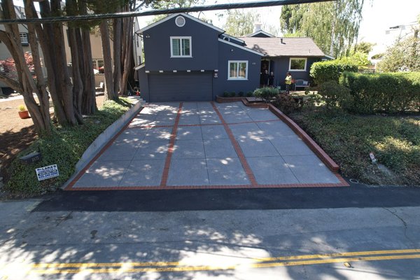 Oakland Hills - Exposed aggregate Driveway with Brick Border and Dividers - We removed existing asphalt driveway and replaced it with a dark gray colored driveway with exposed aggregate finish and brick borders and dividers.