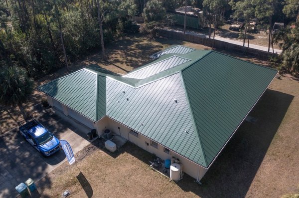 Beautiful Green Metal Roof Project - Take a look at this beautiful green metal roof project completed in Orlando, FL. This reroof replaced an older roofing system with a durable metal roof that delivers both a clean, modern look and long-term performance.
Metal roofing is a great option for Florida homes, offering strong resistance to heat, rain, and storms while helping improve energy efficiency. This project is a great example of how a metal reroof can upgrade both the appearance and reliability of a home. Beautiful Green Metal Roof Project - Take a look at this beautiful green metal roof project completed in Orlando, FL. This reroof replaced an older roofing system with a durable metal roof that delivers both a clean, modern look and long-term performance.
Metal roofing is a great option for Florida homes, offering strong resistance to heat, rain, and storms while helping improve energy efficiency. This project is a great example of how a metal reroof can upgrade both the appearance and reliability of a home.