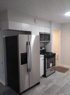 Kitchen Remodel Transformation! - Before:
The original kitchen was severely outdated and in desperate need of attention. Old fixtures and finishes had been completely removed, leaving behind damaged walls, worn flooring, and exposed plumbing. The space felt neglected and unusable, lacking storage, functionality, and modern appeal.
After:
Our kitchen remodel brought this space back to life with a fresh, modern design. We installed sleek new cabinetry, stylish countertops, and eye-catching backsplash tile. Brand new stainless steel appliances, a deep sink with contemporary fixtures, and easy-to-clean tile flooring now provide both beauty and durability. Bright new lighting and a well-organized layout make this kitchen comfortable and functional! Kitchen Remodel Transformation! - Before:
The original kitchen was severely outdated and in desperate need of attention. Old fixtures and finishes had been completely removed, leaving behind damaged walls, worn flooring, and exposed plumbing. The space felt neglected and unusable, lacking storage, functionality, and modern appeal.
After:
Our kitchen remodel brought this space back to life with a fresh, modern design. We installed sleek new cabinetry, stylish countertops, and eye-catching backsplash tile. Brand new stainless steel appliances, a deep sink with contemporary fixtures, and easy-to-clean tile flooring now provide both beauty and durability. Bright new lighting and a well-organized layout make this kitchen comfortable and functional!