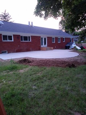 Backyard patio area - We poured this patio with curved radius. We grade area and level, add rebarb and then the concrete is added Backyard patio area - We poured this patio with curved radius. We grade area and level, add rebarb and then the concrete is added
