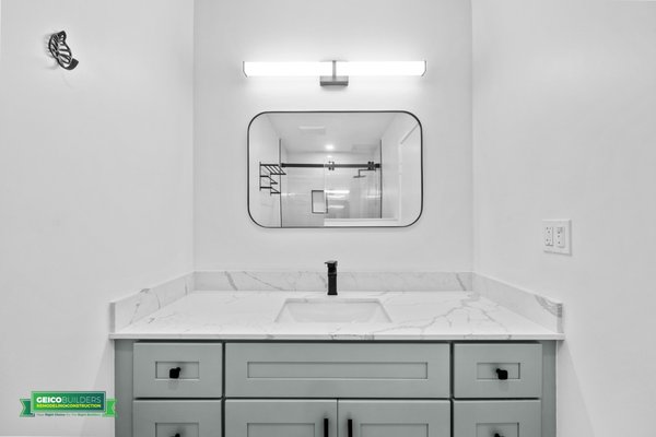 Two Full Bathroom Remodeling Condominium - Oakland - Modern and stylish bathroom vanity area. The crisp white countertop with its clean lines and integrated sinks offers a sleek and uncluttered look. Combination of accents, bespoke lighting, and refined fixtures create an ambiance of opulence. Dual vanities, a soaking tub, and a glass-encased shower redefine indulgence. Elevate your routine in this sanctuary of elegance. Two Full Bathroom Remodeling Condominium - Oakland - Modern and stylish bathroom vanity area. The crisp white countertop with its clean lines and integrated sinks offers a sleek and uncluttered look. Combination of accents, bespoke lighting, and refined fixtures create an ambiance of opulence. Dual vanities, a soaking tub, and a glass-encased shower redefine indulgence. Elevate your routine in this sanctuary of elegance.