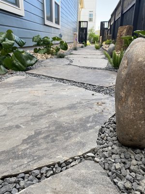 Stand up flagstone patio walkway and xeriscaping - This project was short and sweet our client was a wonderful person the days were super hot and the the stones are extremely heavy even so a beautiful masterpiece was constructed given the tiny space that was used Adam and his crew packed in so much detail and value we really take pride and enjoyment out of the passion to create beautiful pieces of art for your home and property. Stand up flagstone patio walkway and xeriscaping - This project was short and sweet our client was a wonderful person the days were super hot and the the stones are extremely heavy even so a beautiful masterpiece was constructed given the tiny space that was used Adam and his crew packed in so much detail and value we really take pride and enjoyment out of the passion to create beautiful pieces of art for your home and property.