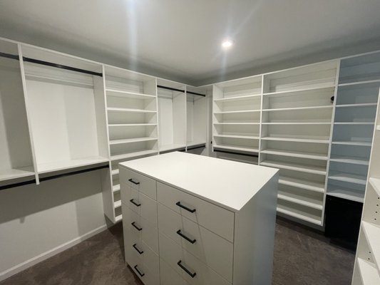 Master Closet with Island Roseville - This beautiful City of Roseville master closet was exactly what our customer was hoping for in their quest for organization and elegance. It was our pleasure to deliver! And that closet island full of customer soft close drawers and designer handles finishes the installation off perfectly! Master Closet with Island Roseville - This beautiful City of Roseville master closet was exactly what our customer was hoping for in their quest for organization and elegance. It was our pleasure to deliver! And that closet island full of customer soft close drawers and designer handles finishes the installation off perfectly!