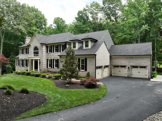 Beautiful New Roof with Black Gutters - This home introduced a new roof, siding, and gutters with gutter guards. Talk about a show-stopper house!