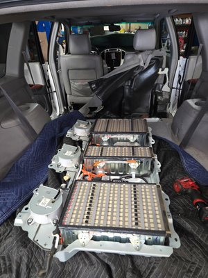 Hybrid Battery Rebuild - For this Toyota Highlander, the customer hired us to fully rebuild the hybrid battery pack. This wasn’t your typical Prius battery job—Highlander packs are larger and more complex, requiring advanced skills to carefully disassemble, rebuild, and reassemble the system. The entire process took two days, and we’re proud to say it was a complete success. The customer approved the final results and left extremely satisfied! Hybrid Battery Rebuild - For this Toyota Highlander, the customer hired us to fully rebuild the hybrid battery pack. This wasn’t your typical Prius battery job—Highlander packs are larger and more complex, requiring advanced skills to carefully disassemble, rebuild, and reassemble the system. The entire process took two days, and we’re proud to say it was a complete success. The customer approved the final results and left extremely satisfied!