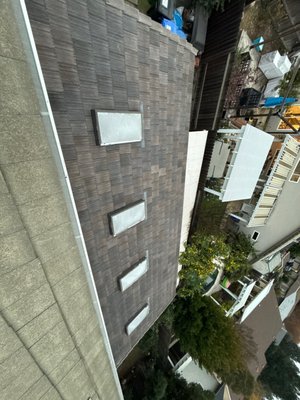 Patio Tile Conversion - The patio was originally constructed with a shingle roofing system. Per homeowner request, the roof assembly was modified and converted to a tile roofing system to match the existing tile roof on the main structure. Patio Tile Conversion - The patio was originally constructed with a shingle roofing system. Per homeowner request, the roof assembly was modified and converted to a tile roofing system to match the existing tile roof on the main structure.