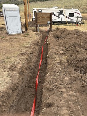 Trenches for new electric line. - Trenches for new electrical service. Trenches for new electric line. - Trenches for new electrical service.