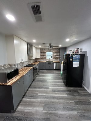 Kitchen Remodel in Bedford, Tx - This kitchen was transformed from outdated and in need of an update to a modern, functional space. We collaborated closely with the homeowner to design their ideal kitchen and source materials.
We completely gutted the old kitchen. While it was open, we took the opportunity to install two new windows and a new back door for improved natural light and access. We then fitted the space with new upper and lower cabinets, featuring elegant butcher block countertops and a stylish built-in farm sink. A beautiful backsplash and floating shelves were installed to enhance the overall aesthetic.
To further improve the kitchen, we upgraded the lighting with new LED fixtures and installed a fresh floating floor. We also took care of all the necessary drywall work and painting to give the space a cohesive and polished look. Finally, we completed the remodel by upgrading the stove and installing a powerful ventahood for a more enjoyable cooking experience.
This kitchen remodel not only modernized the space but also added functionality and visual appeal, setting the stage for a stunning interior transformation throughout the rest of the home. Kitchen Remodel in Bedford, Tx - This kitchen was transformed from outdated and in need of an update to a modern, functional space. We collaborated closely with the homeowner to design their ideal kitchen and source materials.
We completely gutted the old kitchen. While it was open, we took the opportunity to install two new windows and a new back door for improved natural light and access. We then fitted the space with new upper and lower cabinets, featuring elegant butcher block countertops and a stylish built-in farm sink. A beautiful backsplash and floating shelves were installed to enhance the overall aesthetic.
To further improve the kitchen, we upgraded the lighting with new LED fixtures and installed a fresh floating floor. We also took care of all the necessary drywall work and painting to give the space a cohesive and polished look. Finally, we completed the remodel by upgrading the stove and installing a powerful ventahood for a more enjoyable cooking experience.
This kitchen remodel not only modernized the space but also added functionality and visual appeal, setting the stage for a stunning interior transformation throughout the rest of the home.