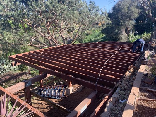Deck with Trex decking and redwood - This project was replacing an old deck with one 3x bigger with a new better product that lasts a lot longer.￼ The decking is trex with hidden fasteners. The handrails are redwood with pressure treated framing and cable system￼ hand railing.