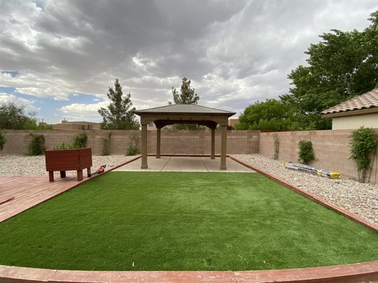 Backyard Renovations Available - Starting off with a bare backyard thanks to our client, leaving us with a great starting point in our project. We worked along side with them to make sure everything was done according to their needs. We started off leveling the ground with crusher fine along with lining it with landscape fabric to help eliminate weed growth thru the artificial grass. First piece to the puzzle was to pour and stamp the beautiful concrete. Secondly we installed a very nice artificial grass. The last piece to the puzzle was to put together a gazebo where it would give them a nice shady area to enjoy the summer. Call Us To Schedule Your Project Today! Backyard Renovations Available - Starting off with a bare backyard thanks to our client, leaving us with a great starting point in our project. We worked along side with them to make sure everything was done according to their needs. We started off leveling the ground with crusher fine along with lining it with landscape fabric to help eliminate weed growth thru the artificial grass. First piece to the puzzle was to pour and stamp the beautiful concrete. Secondly we installed a very nice artificial grass. The last piece to the puzzle was to put together a gazebo where it would give them a nice shady area to enjoy the summer. Call Us To Schedule Your Project Today!