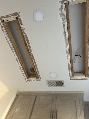 Ceiling Botched Drywall Repair - Customer previously hired a contractor to remove old cfl lights and install new led recessed lighting. The contractor removed the lighting fixtures and completed the ceiling drywall. A couple of days later I was called to come over and repair the improperly installed ceiling drywall. After completing the repairs we were contracted to paint the downstairs living room, stairwell and kitchen area. Ceiling Botched Drywall Repair - Customer previously hired a contractor to remove old cfl lights and install new led recessed lighting. The contractor removed the lighting fixtures and completed the ceiling drywall. A couple of days later I was called to come over and repair the improperly installed ceiling drywall. After completing the repairs we were contracted to paint the downstairs living room, stairwell and kitchen area.