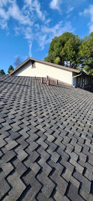 Fremont Apartments & Condos Reroof Installation - We worked with the HOA of this complex to completely redo their roofing. We removed comp shingles, replaced rotted areas on fields and fascia boards. We installed new 2x6 and 2x8 fascia boards, and replaced multiple areas of plywood. We installed new step shingles and counter flashings on the walls. We have installed synthetic underlayment, starter roll, starter color all on eaves. We added new metal flashings on the chimneys with cricket. We tore off the old garage tar roofs and installed new torch roofs by adding base roll, smooth roll, and torch roll. We added 2x2 drip edge and 2x3 gravel stop metal. We also added new gutters to all roofs. The roofs are now all new, meet title 24 requirements for the state of California, with the new O'Hagan vents that release old hot air and increase air ventilation. The apartment complex also has a new, refreshed look.