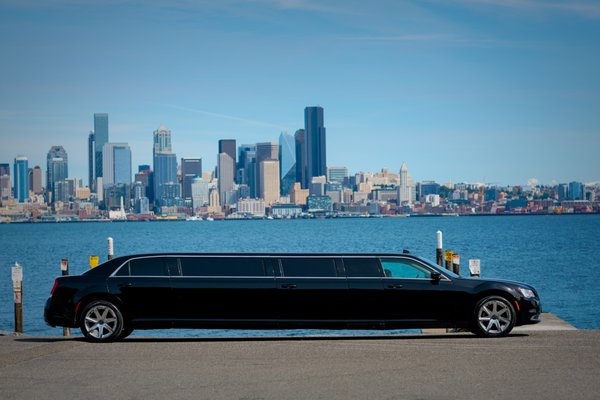 Luxury Limousine - Our newest 300c Stretch offers “J” seating, overhead lighting with optional light displays, and a gorgeous bar area with glassware and a cooler. The plush black leather seating and rear climate control offer the ultimate passenger comfort. Top it all off with a flat panel monitor and superior sound system and this is the perfect vehicle to get your party started off with a bang. Luxury Limousine - Our newest 300c Stretch offers “J” seating, overhead lighting with optional light displays, and a gorgeous bar area with glassware and a cooler. The plush black leather seating and rear climate control offer the ultimate passenger comfort. Top it all off with a flat panel monitor and superior sound system and this is the perfect vehicle to get your party started off with a bang.