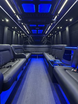 26 Passenger Limo Bus - Looking to elevate your next event? Step inside our luxurious 26-passenger limo bus — where comfort, style, and entertainment come together. This ride features premium wraparound seating, designed for group fun and comfort. Crank up the party with a high-fidelity sound system, Bluetooth radio, and strobe lights that set the vibe just right. For privacy and entertainment, enjoy window curtains, Apple TV, and two 50” smart TVs — perfect for music videos or custom content. Stock up your celebration at the built-in bar and beverage cooler, all within arm’s reach. With WiFi, power outlets, and USB charging ports, staying connected is easy. Perfect for weddings, prom nights, wine tasting, birthday parties, or just a night out with friends.