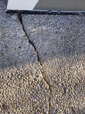 Pebble finish concrete repair job. - This was a repair for a customer looking to sell their home. They didn’t want to do the entire driveway but they wanted us to try to repair and match the damage to a pebble finished driveway as close as possible. Our concrete professionals came through in a big way. Call 210-364-9321 for a free estimate today.