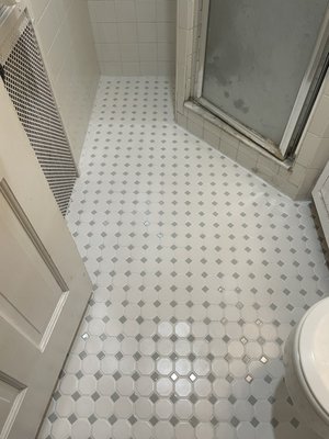 Tiling job - This bathroom was older and the owner wanted to replace the floor first, as she could not do the whole bathroom at once.

I removed the old tile flooring, made sure the subfloor was in good condition and purchased and layered the new tile afterwards.